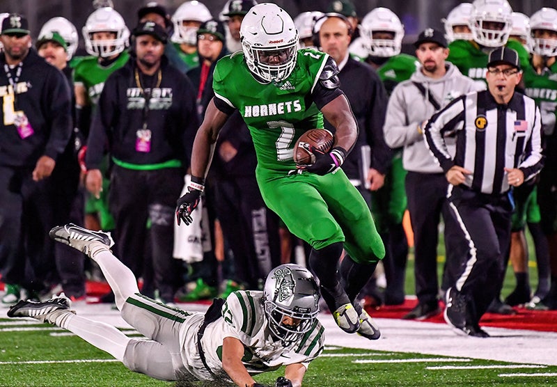 Lincoln running back Roderick Robinson picks up extra yardage in the CIF Division 1-AA finals Friday at Saddleback College in Mission Viejo. (Photo: Louis Lopez)