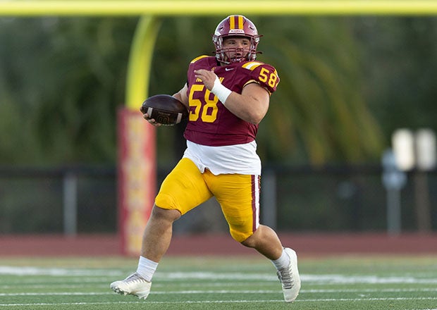 Cardinal Newman lineman Devon Bertoli rumbles up the field after one of this team's six interceptions against Grant. (PHOTO: Charles Chang)