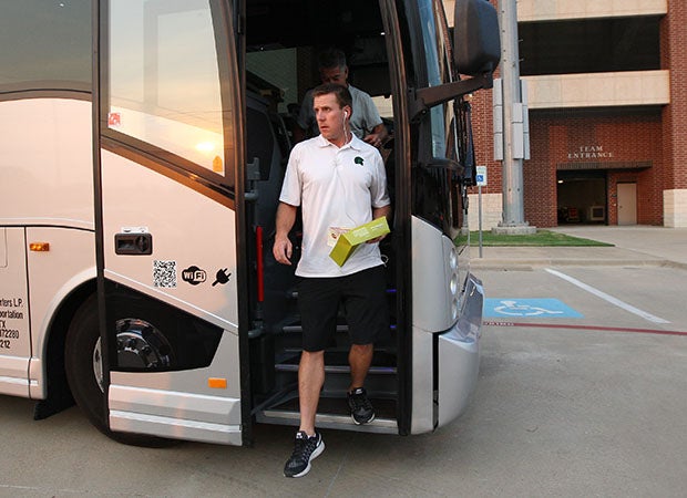 De La Salle head coach Justin Alumbaugh gets off the team bus Thursday in Mansfield, Texas.
