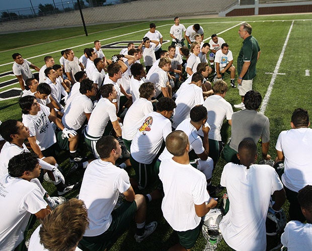 De La Salle defensive coordinator Terry Eidson addresses his team at practice Thursday night at Vernon Newsom Stadium in Mansfield, Texas. That is where the Spartans will play Trinity (Euless) on Saturday night.