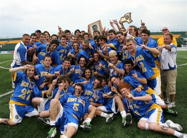 Nicky Galasso (front and center, No. 5) and West Islip celebrate a victory in New York's Class A championship game.