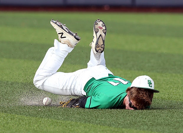Southlake Carroll (Southlake, Texas) outfielder Ryan Ryskoski attempts to make a diving catch during a quarterfinal game in the UIL 6A Regional playoffs.