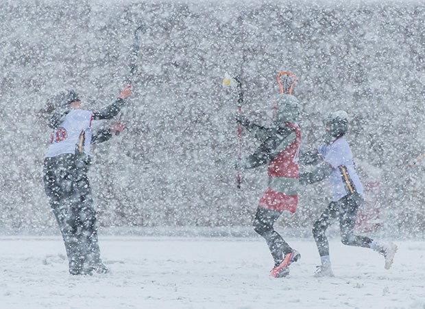 Chaparral (Parker, Colo.) and Aspen (Colo.) players battle through a blizzard during a girls lacrosse game in Colorado in April.