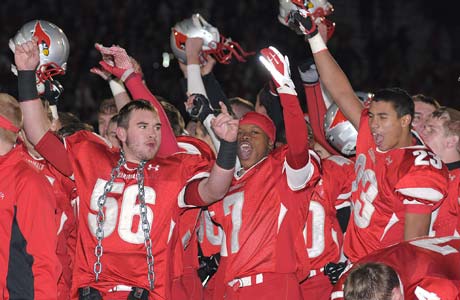 Mentor players celebrate Saturday night following their triple-overtime playoff victory over defending state champion St. Ignatius.