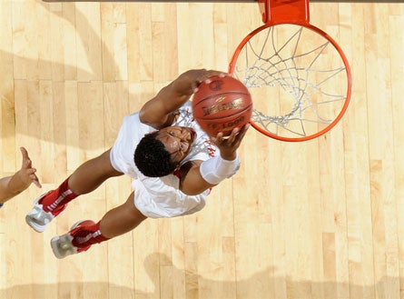 Colorado-bound Xavier Johnson uses both hands in No. 6 Mater Dei's regional final win over Bullard of Fresno on Saturday night.