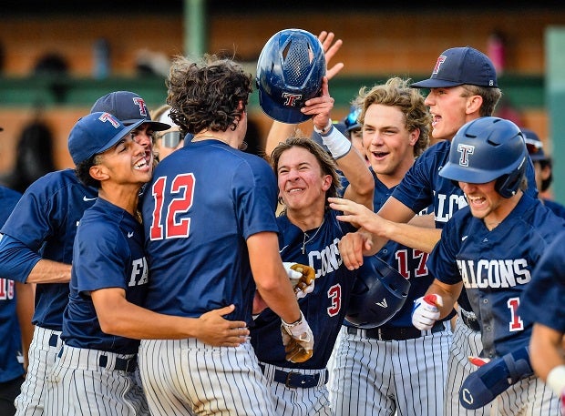 Tompkins players celebrate a Jace LaViolette (12) home run earlier this season.