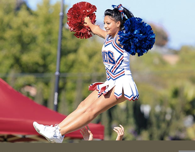 A cheerleader for Crawford (San Diego) keeps her form while being tossed into the air.