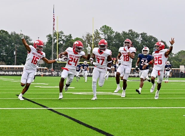 North Shore's Dezmon Christian (24) gets a convoy into the end zone after a blocked punt for a touchdown in the No. 6 Mustangs' 34-28 win over Atascocita. (Photo: Tom Dendy)