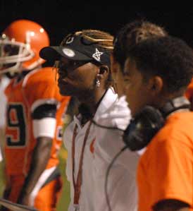 Coolidge head coach Natalie Randolph looks on during Friday night's 28-0 loss to Archbishop Carroll.