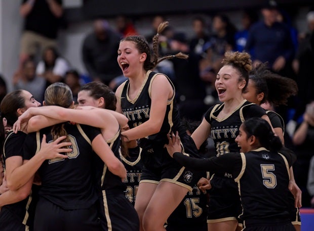 Archbishop Mitty players celebrate their 73-72 Nike TOC championship win over No. 1 Long Island Lutheran on Thursday. (Photo: Darin Sicurello)