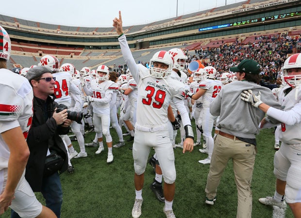 The Woodlands safety Cole Langston and his teammates celebrate their playoff victory over Allen.
