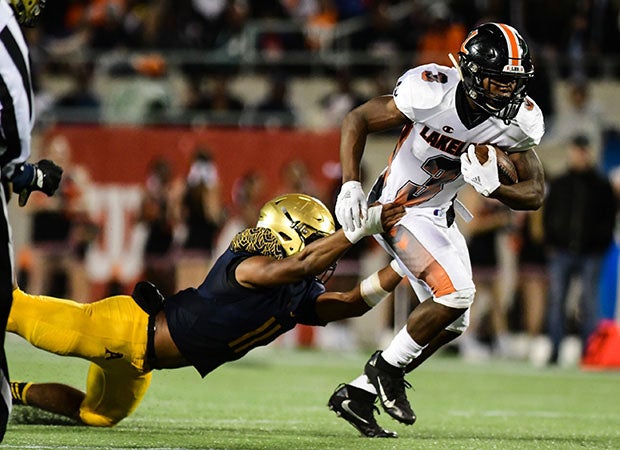 Demarkcus Bowman rushed for an 80-yard touchdown to open the scoring of Lakeland's 33-20 7A Florida championship win over St. Thomas Aquinas. 