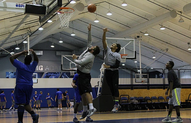 Foster goes up for a rebound against another of his teammates, Jerrell Scroggins, during a pickup game of ‘around the world’ on one of IMG Academy’s four basketball courts.