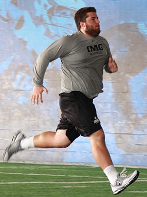 Foster works on speed after an intense weights
session, and sprints across the 60-yard covered turf
facility.