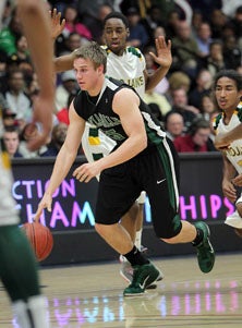 Travis Pacos driving in NCS
finals against Castro Valley.