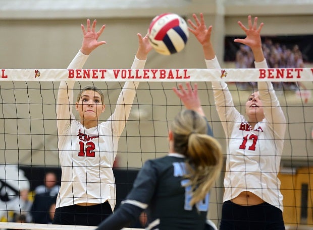 Lynney Tarnow and Keira O'Donnell go for a block in a recent match for No. 3 Benet Academy. The Redwings are 33-0 and have dropped one set all season as Benet closes the regular season this week. (Photo: Norman Cohen)