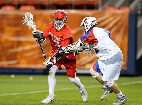 Regis standout Jake Taylor, left, powers the Raiders into the Class 5A boys lacrosse playoffs as the state's top seed. Taylor leads the classification with 50 goals.