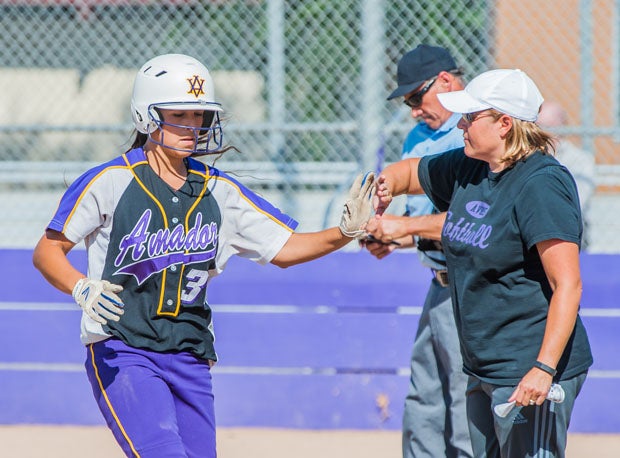 Junior left fielder Courtney Hennings gets plenty of encouragement from Amador Valley coach Teresa Borchard.