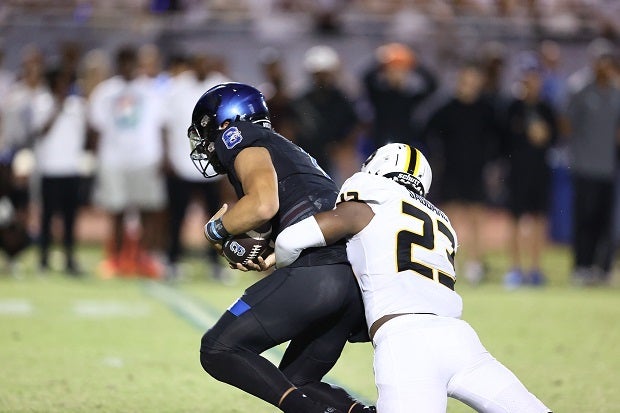 Saguaro's John Butler sacks Chandler quarterback Dylan Raiola, but the Wolves beat Saguaro 31-21 on Friday.