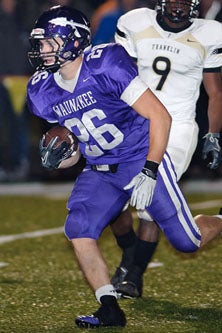 Waunakee's Derek Straus runs down hill.