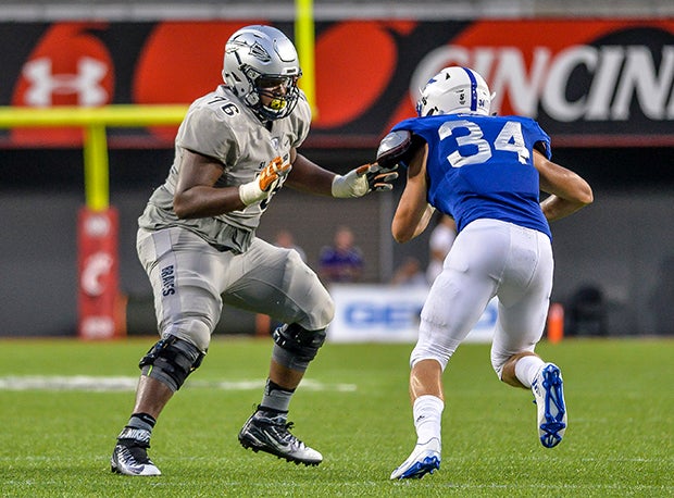 St. Xavier senior Blake Bacevich (right) goes against current Ohio State freshman Wyatt Davis during a game last season.