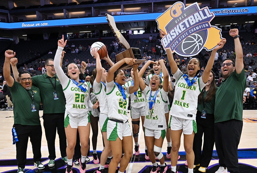 Sierra Pacific players and coaches hoist the CIF Division II trophy after beating St. Joseph 56-47 on Saturday at Golden 1 Center in Sacramento. (PHOTO: David Steutel)