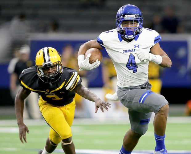 Chandler running back T.J. Green breaks into the open while trailed by a Valdosta defender.