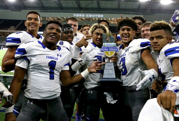 Chandler (Ariz.) players proudly display the Geico State Champions Bowl Series trophy following their victory over Valdosta (Ga.) at The Star in Texas.