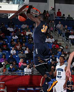 Randle soars for one of his highlight
dunks in Friday's victory.