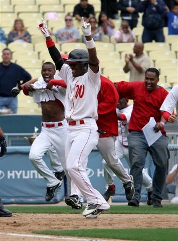 Westchester's Chris Jacobs approaches home plate after his second home run at Dodger Stadium.