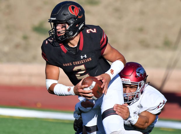Matt Corral evades a tackler last season at Oaks Christian.