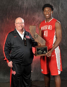 Mater Dei head coach Gary McKnight and Stanley Johnson share a moment with their fourth state championship trophy.