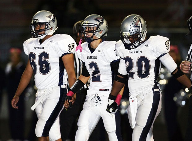 Joe Mixon (20) is always been called a team player by his coach Kevin Hartwig. He's joined by Nick Garcia (2) and Amador Miramontes (66) for an opening coin flip at a recent game.