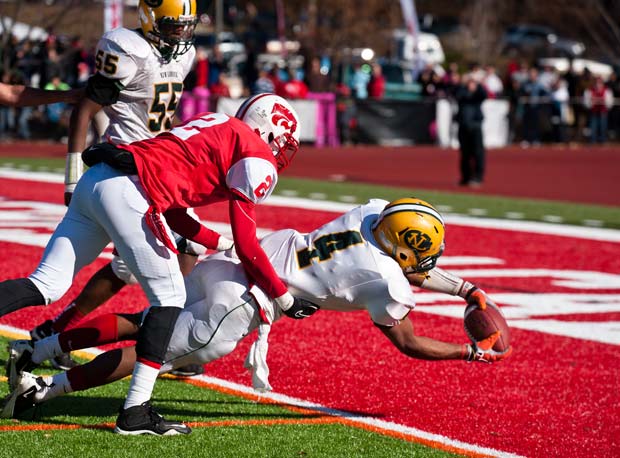 New London and Norwich Free Academy do battle in this Thanksgiving, 2011 photo. The schools will match up again on the holiday this season like they have every year since 1875.