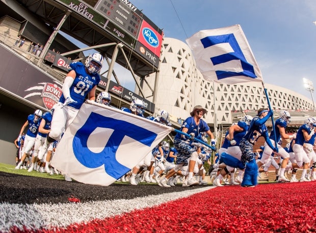 Regular Skyline Chili Crosstown Showdown participant St. Xavier takes the field at Nippert Stadium in 2015.
