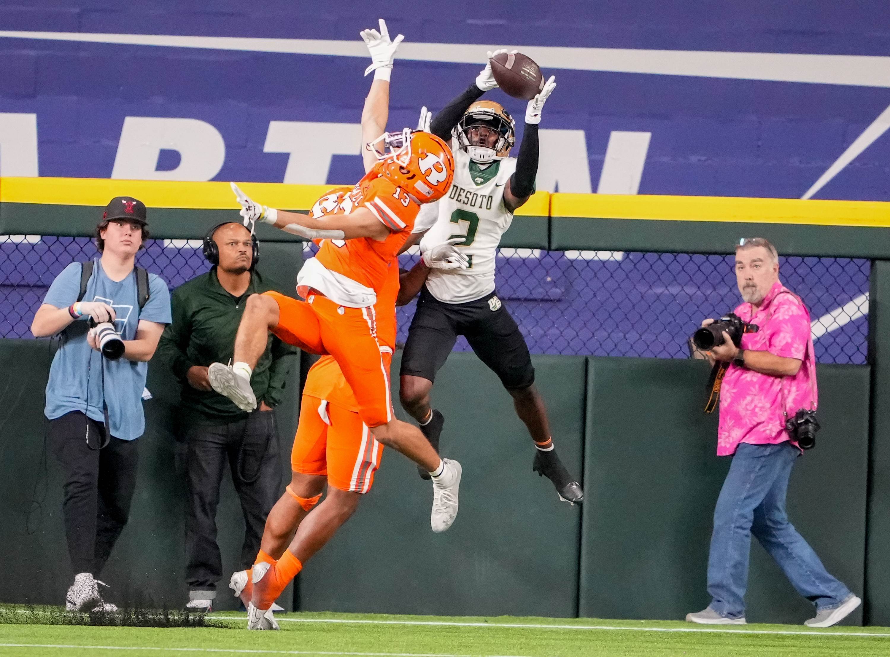 Desoto WR Mike Murphy catches a TD pass as Rockwall CB Cadien Robinson defends. 6A Area Playoff
