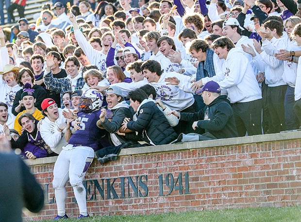 Christian Brothers College's (MO) RJ White celebrates a fumble recovery with the Christian Brothers College student section during the MSHSAA Class 6 Championship game against Liberty North.