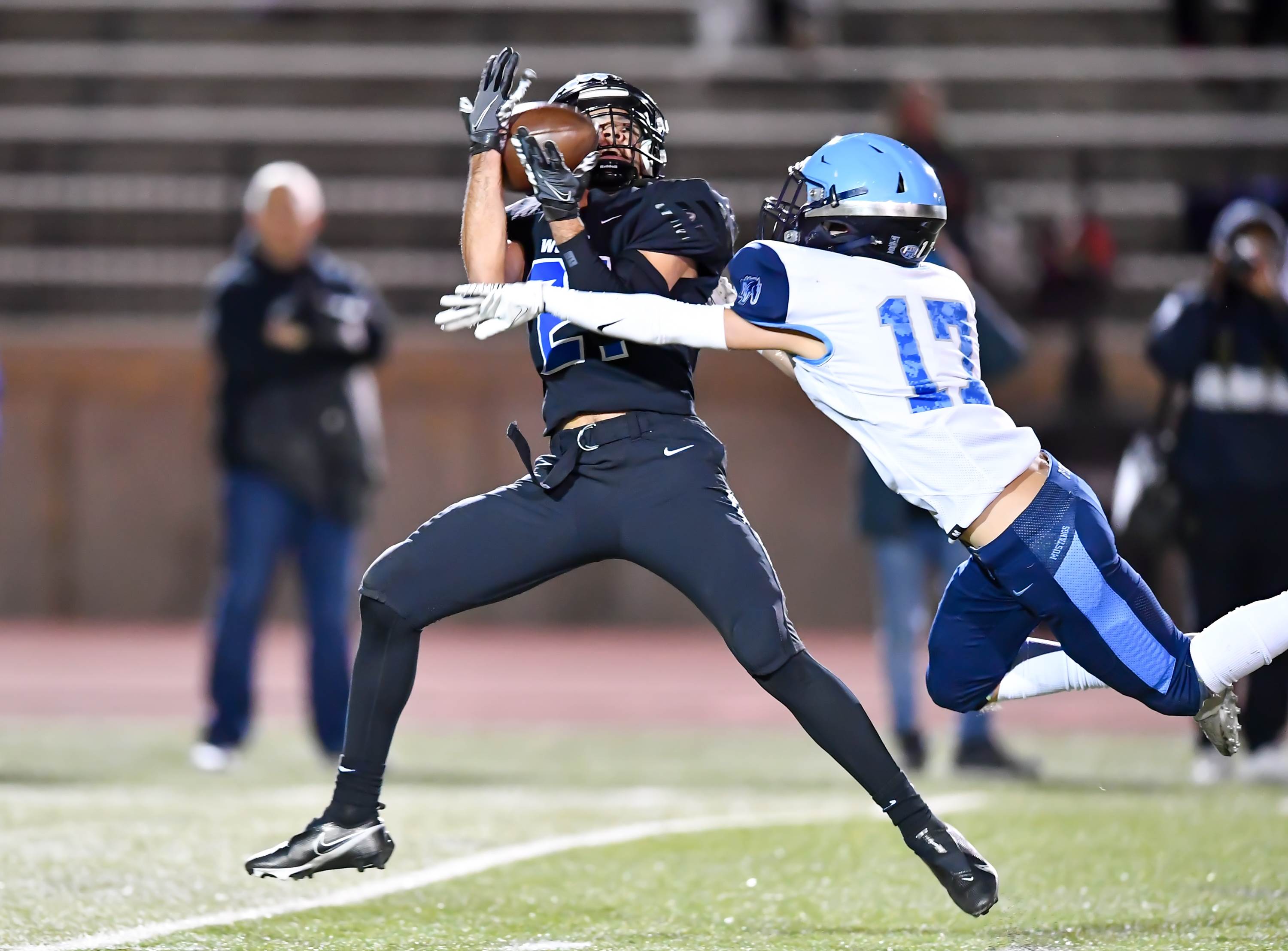 Grandview WR Preston Baker (21) makes the 40 yard reception over Ralston Valley CB Davis Brickle (17) to put Grandview ahead late in the 4th quarter of the Colorado 5A State High Quarterfinals. Grandview went on to win 20-16.