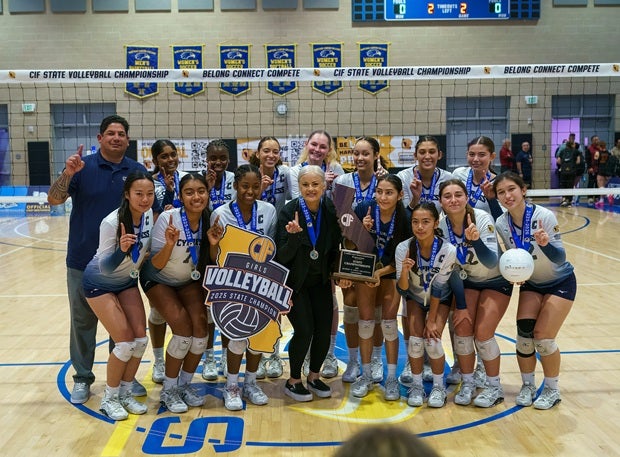 Cypress players and coaches enjoy the school's first state title after beating Clovis West in the Division II final.(PHOTO: Diane Torrence)