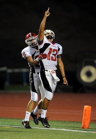 QB Sean Young points the week following Kevin's passing.