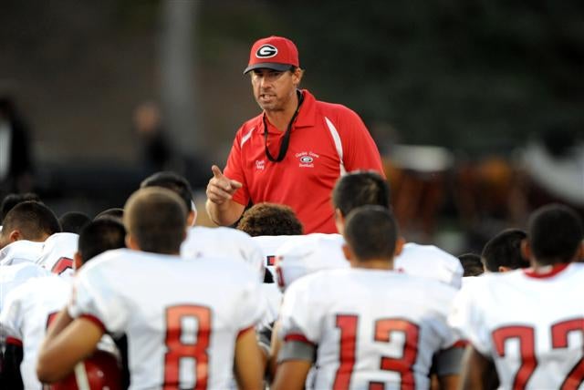Garden Grove coach Joe Hay addresses team after victory against Woodbridge.