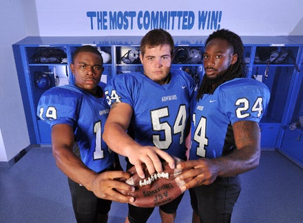 L-R Erick Striker, Cody Waldrop and Matt Jones lead Armwood into Gorman. Jones will not play with knee injury.