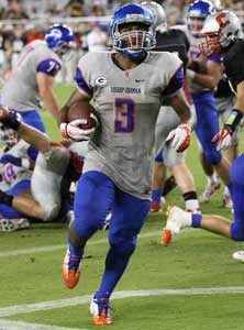 Gorman's Shaq Powell with one of his
six touchdowns last week.