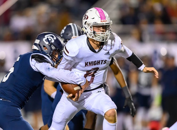 Easton Comer avoided all Corner Canyon pressure Friday to throw for four touchdowns, three to Crew McChesney, in Lone Peak's 49-42 6A state final victory.