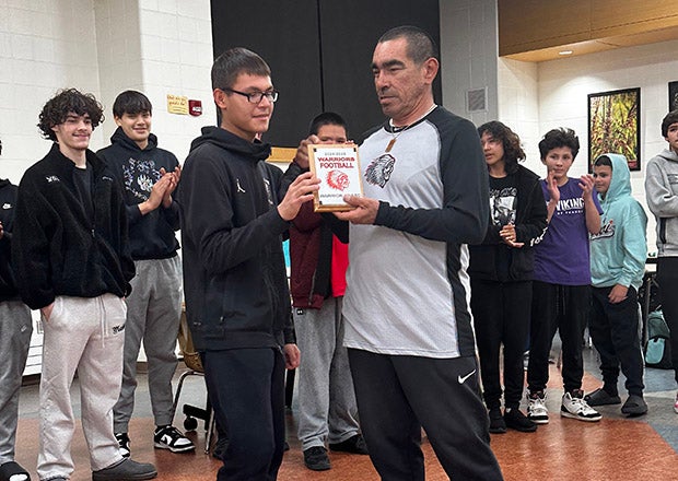 Shown here presenting an award at last season's banquet, Red Lake head coach Nolan Desjarlait took over in 2008 and is still searching for his first win. The Warriors got close to the elusive victory in this season's opener. (PHOTO: Jody Johnson)