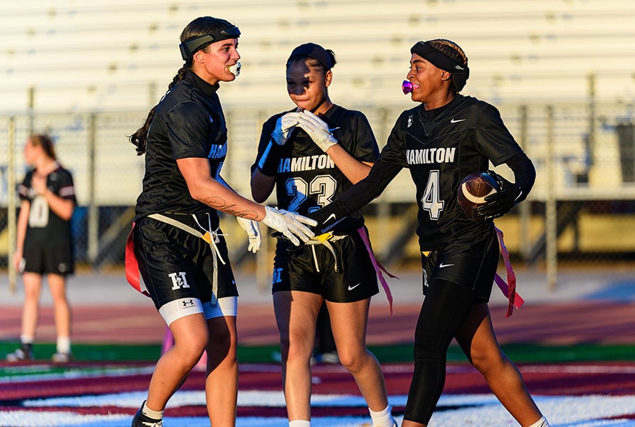 Hamilton sophomore Harmony Cosby is congratulated after scoring touchdowns during the Huskies' 2-0 start to 2026. No. 5 Hamilton enters the week with 40 straight wins. (PHOTO: Jack Beasley)