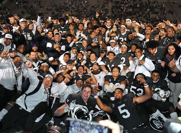 St. John Bosco players celebrate after their CIF Open Division title win over De La Salle on Saturday.