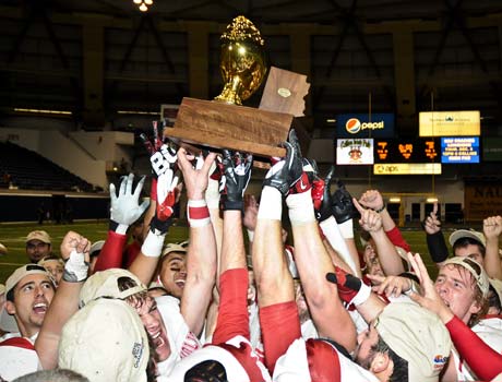 Seton Catholic players raise the championship trophy after winning the Division 4 title on Friday.