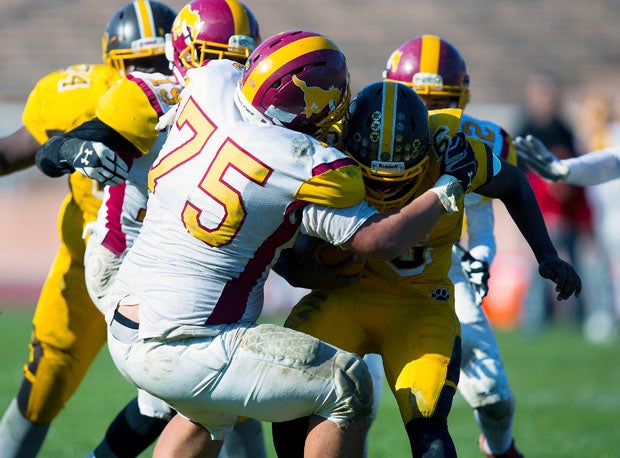 The Lincoln defensive front was outstanding and in the middle — and on bottom often — was Phelps (75).