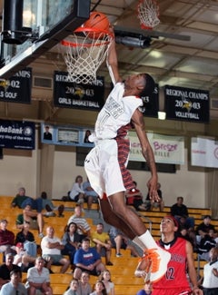 Chester's Diamonte Reason rises for adunk against Lake Highland Prep.
